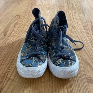 Converse with blue and gold sparkles.